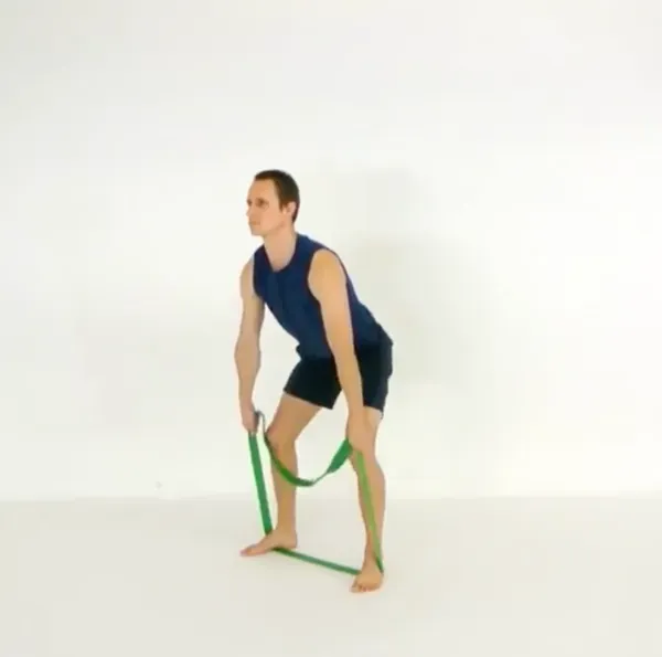 A long loop band held in both hands and pinned under both feet